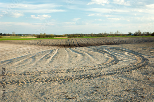 Traces of the tractor in the ploughed field