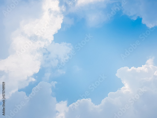 White fluffy cloud on blue sky background.