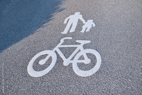 Road markings for pedestrians and bicycles drawn on the asphalt