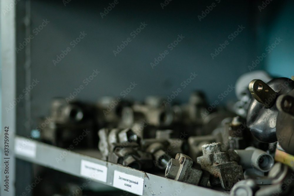 Naklejka premium metal parts in the repair shop in production, parts in the factory