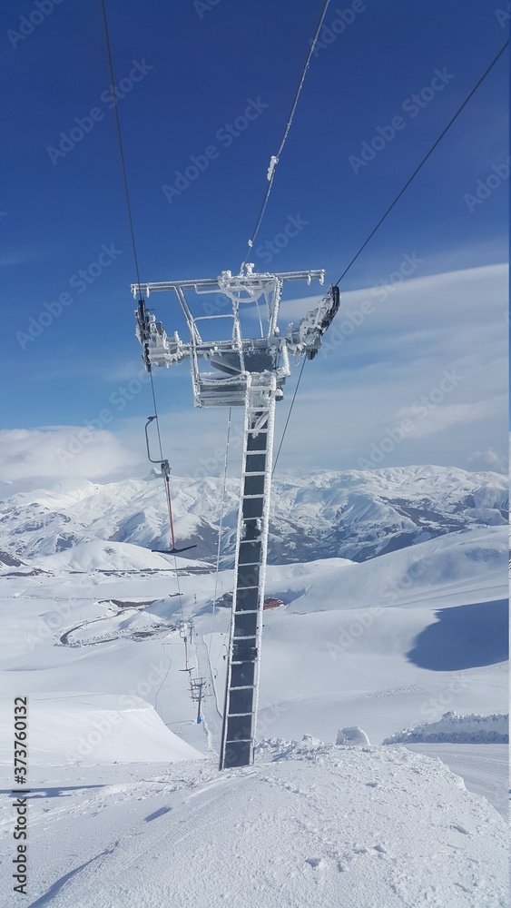 a pole in the snowy mountains
