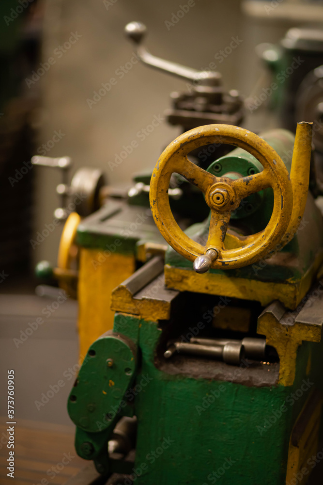 vintage lathe at the factory, turning production
