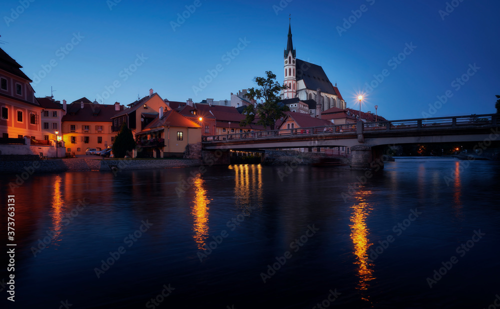 Naklejka premium Photography of Church of St. Vitus in Cesky Krumlov at night, and the Vltava river