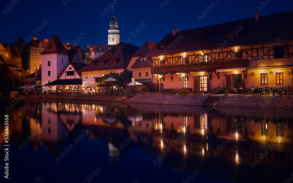 Photography of Church of St. Vitus in Cesky Krumlov at night, and the Vltava river