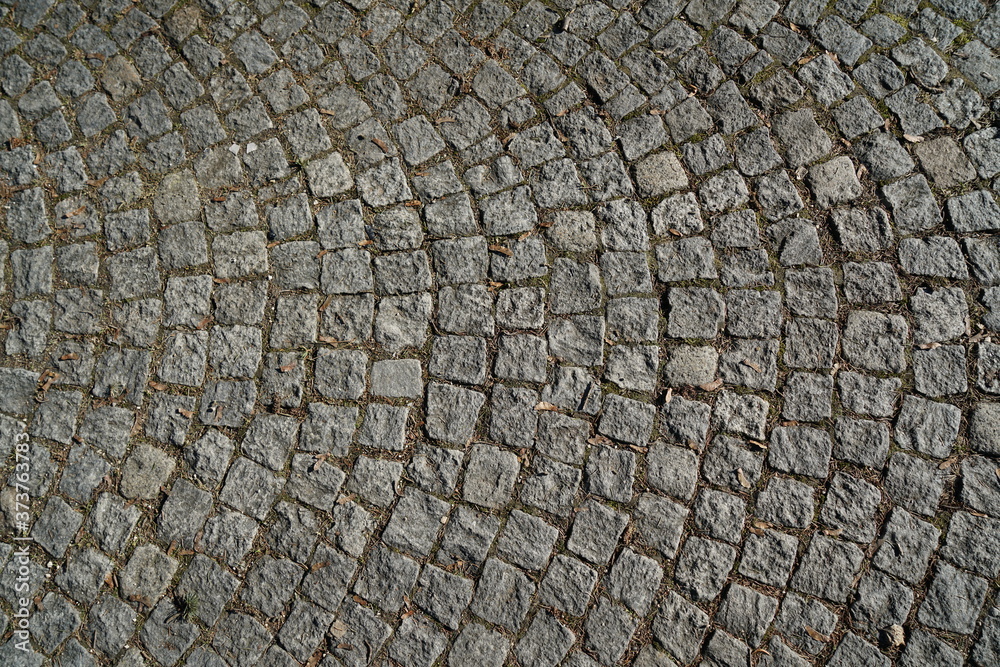 Gray cobblestone artistically laid in a park in Bavaria Gray cobblestone artistically laid in a park in Bavaria