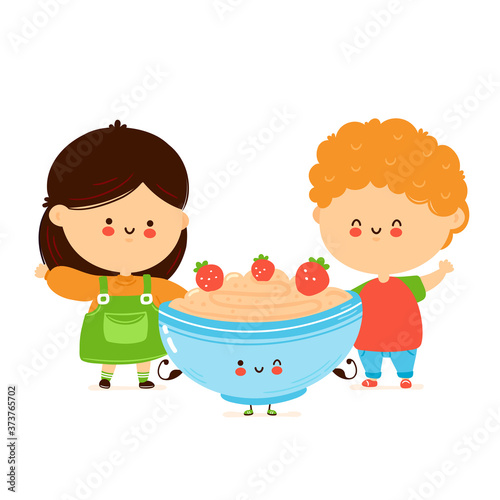 Cute happy kids and bowl of oatmeal porridge