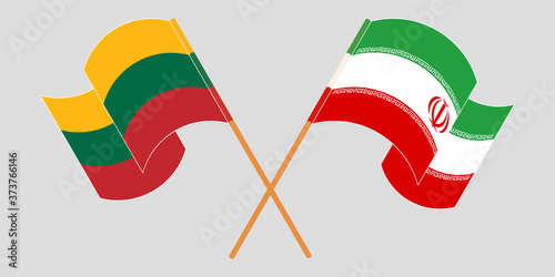 Crossed and waving flags of Iran and Lithuania