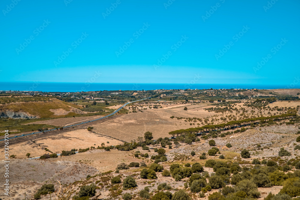 Landscapes with dry fields and farmlands on the southern coast of Sicily near Agrigento Landscapes with dry fields and farmlands on the southern coast of Sicily near Agrigento