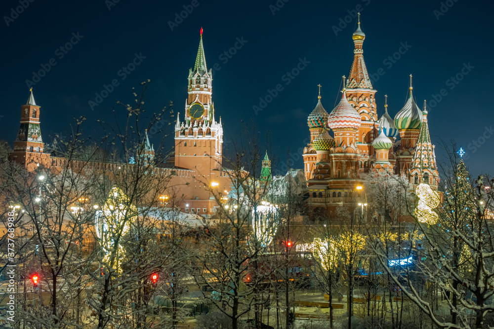 Moscow. Russia. Panorama of the Moscow Kremlin from a distance. Evening in Moscow. The Kremlin against a dark sky. Spasskaya tower of the Kremlin. St. Basil's Cathedral. Night in the Russian capital.
