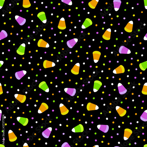 Seamless pattern for the holiday Halloween with candies and sweets. Sugar lollipops of corn grains and candy dots on a black background. The traditional colors of the holiday are orange, green, purple