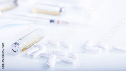 Pills and syringe. Healthcare background