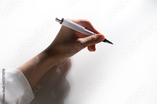 A woman hand with a ballpoi...