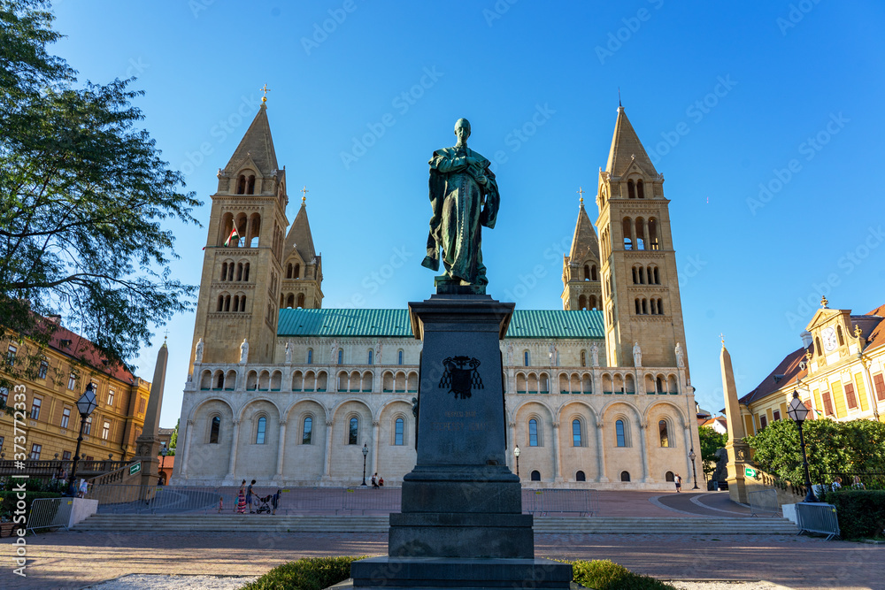 Statue of Ignac Szepesy and Basilica of St. Peter & St. Paul, Pecs Cathedral in Hungary the sign on the statue says Ignac Szepesy bishop
