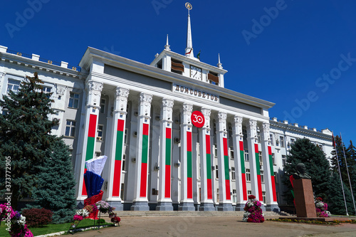 city hall of the Tiraspol, Transnistria, Moldova - the city administration building is decorated with state flags and banners to celebrate the 30th anniversary of independence