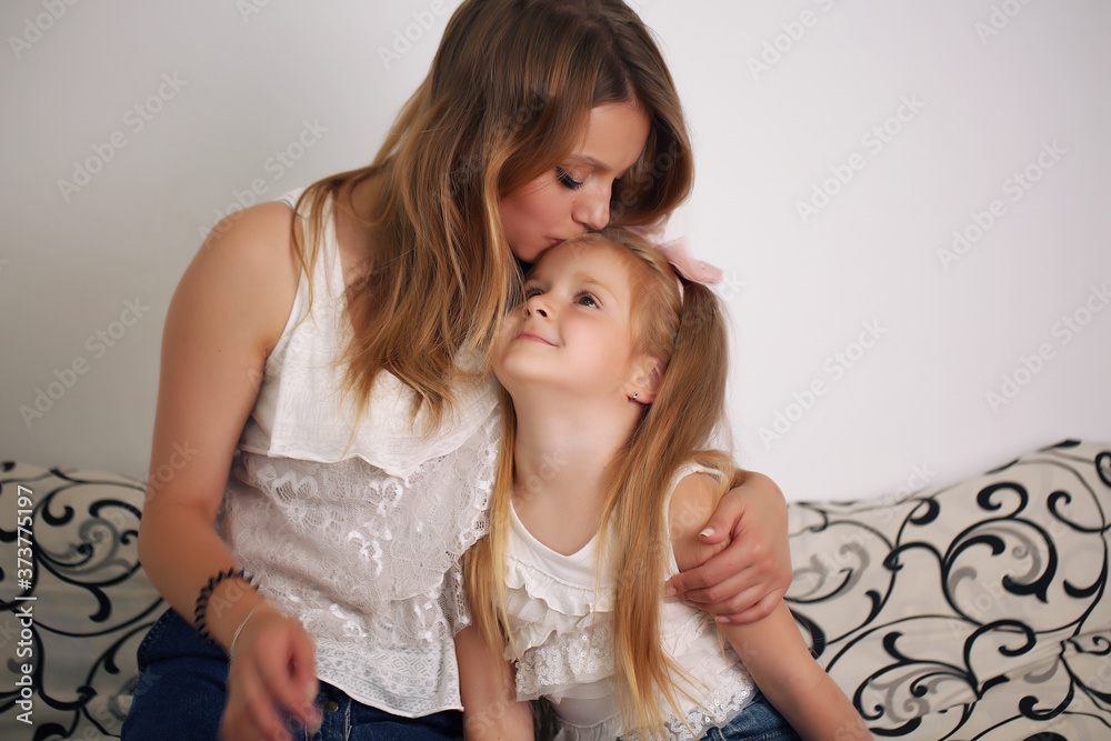 Emotions. Happy loving family. Mother and daughter spend time together at home. Emotions. Happy loving family. Mother and daughter spend time together at home.