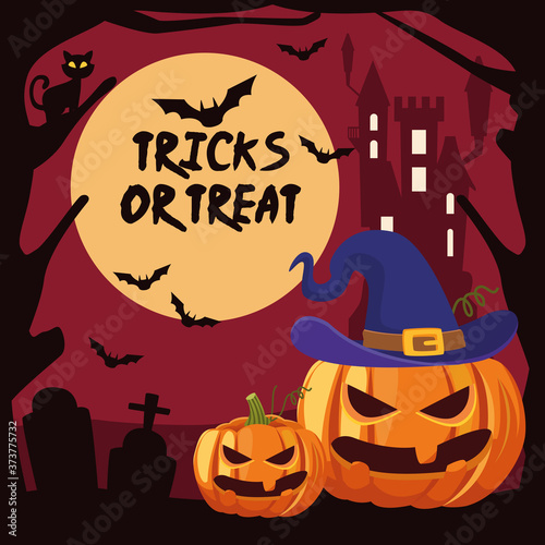 halloween tricks or treat lettering with pumpkis in cemetery