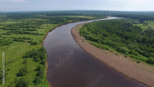 Flying over River in Summer.	The video was taken from a drone flying over the North river among fields and woods
