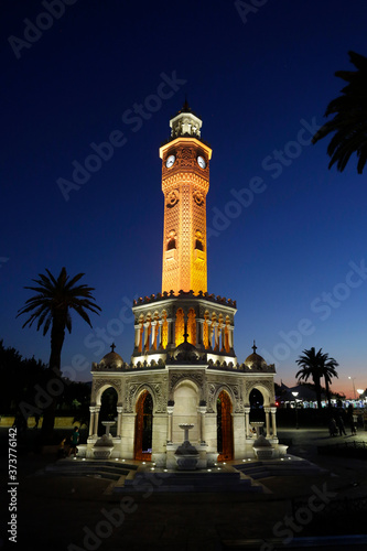 The iconic Clock tower is seen illuminated at Konak district during a beautiful sunset in the coastal city of Izmir, Turkey. © Nelson Antoine