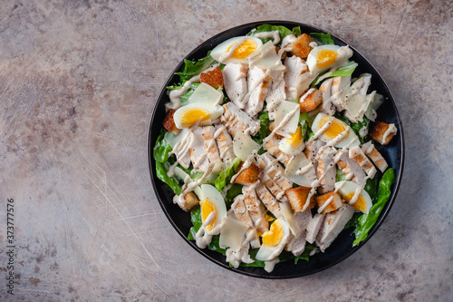 Grilled chicken caesar salad with crunchy croutons