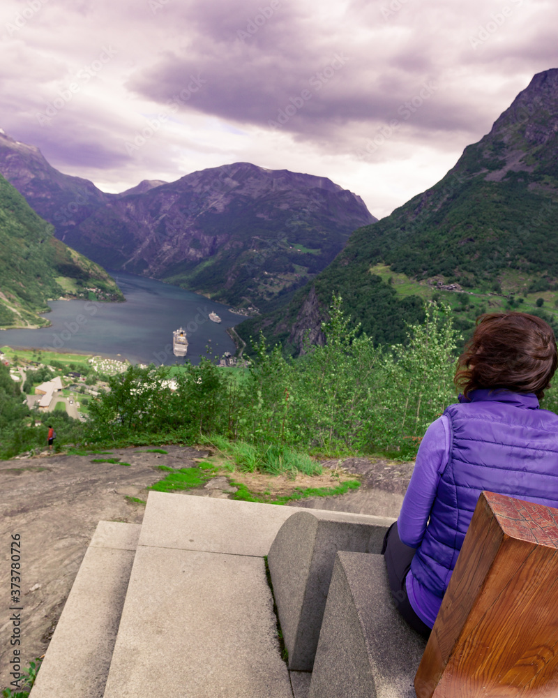 Tourist enjoying Geirangerfjord from viewing point