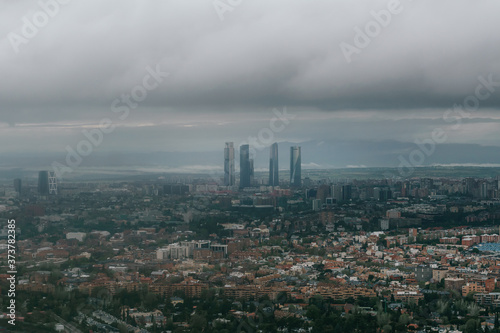 Madrid aerial view in a very cloudy day with a sky scrapers in the background. Landscape. Famous places.