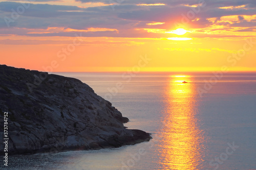Sunset in the ocean. There is a calm sea. Evening in the tropics. Natural background