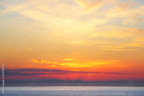 Sunset in the ocean. There is a calm sea. Evening in the tropics. Natural background © hramovnick