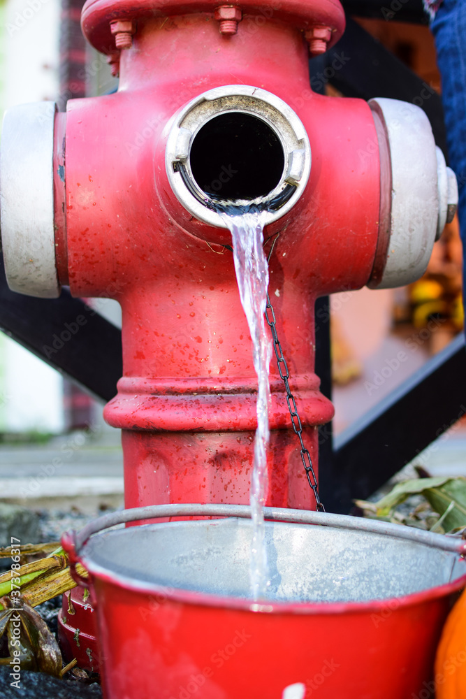 A stream of water pours from a water pump