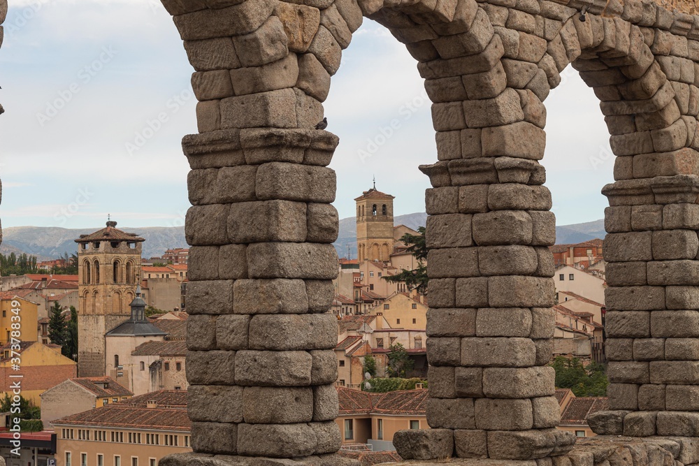 City of Segovia in Spain seen through the arches of the aqueduct monument emblematic of that town