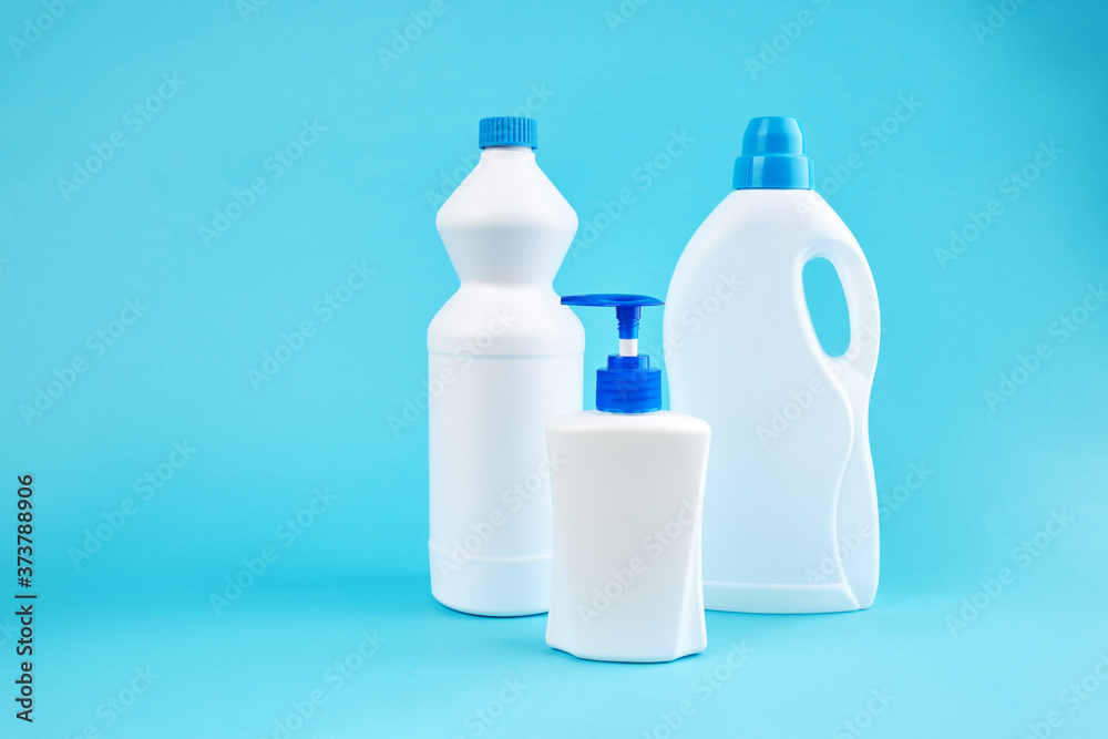 group of blank detergent product bottles over blue background. copy space. cleaning and washing equipment concept group of blank detergent product bottles over blue background. copy space. cleaning and washing equipment concept
