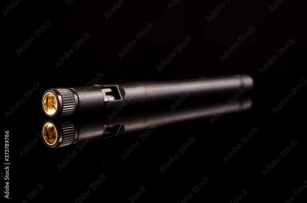 Monopole antenna for IoT and 5G isolated on the black background Monopole antenna for IoT and 5G isolated on the black background