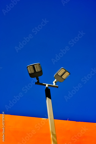 A Lamp pole with Blue and orange background at Rajamangala National Stadium in Bangkok Thailand  photo