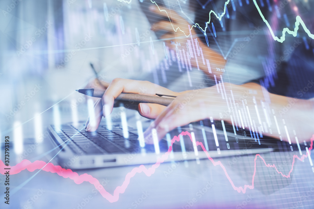 Multi exposure of woman hands typing on computer and financial graph hologram drawing. Stock market analysis concept. Multi exposure of woman hands typing on computer and financial graph hologram drawing. Stock market analysis concept.