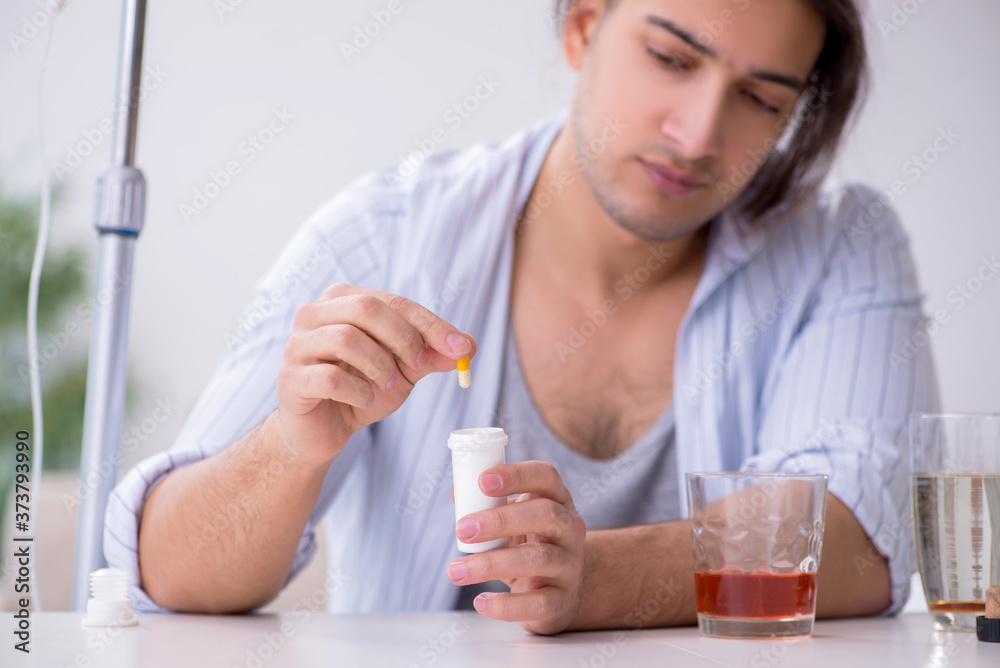 Young man in alcohol addiction treatment concept Young man in alcohol addiction treatment concept