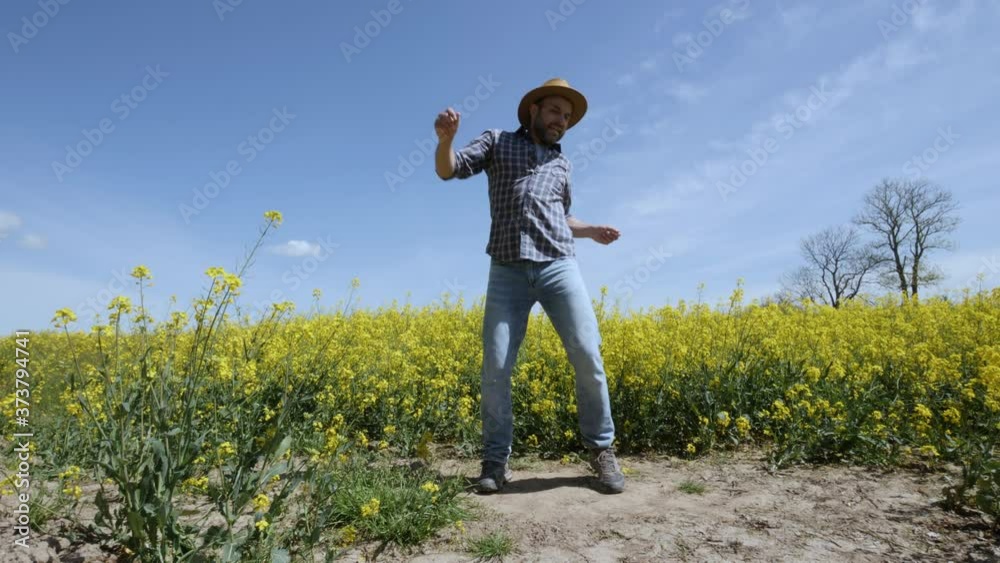 Happy Man Farmer Dancing Enjoying at Rape Blossom On Field. Fun Celebrating Funny Viral Dance Freedom. Guy Enjoying Dance. Joyful Man Farmer Dancing. Slow Motion. Flowering Rapeseed Field Blue Sky. Happy Man Farmer Dancing Enjoying at Rape Blossom On Field. Fun Celebrating Funny Viral Dance Freedom. Guy Enjoying Dance. Joyful Man Farmer Dancing. Slow Motion. Flowering Rapeseed Field Blue Sky.