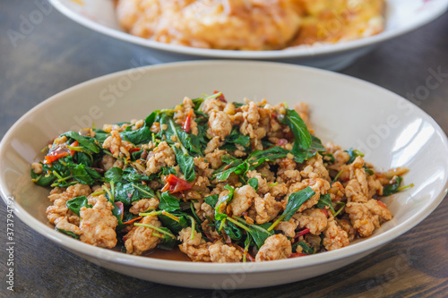 Stir fried pork with basil on the plate is a popular food in Thailand