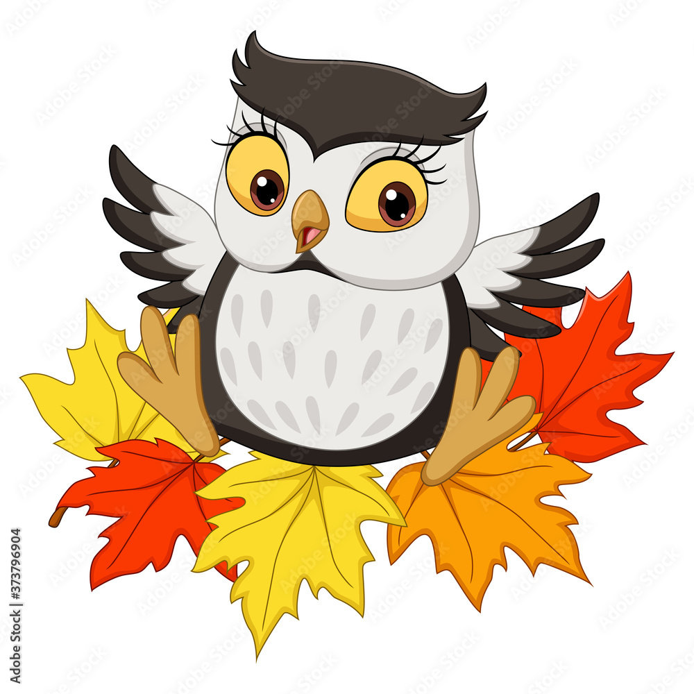 Fototapeta premium Cute owl cartoon sitting on autumn leaves
