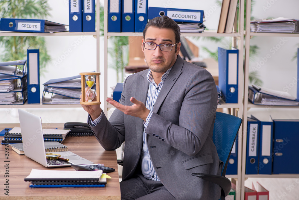 Young male employee businessman at workplace Young male employee businessman at workplace