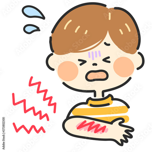 腕に擦り傷を負った男の子