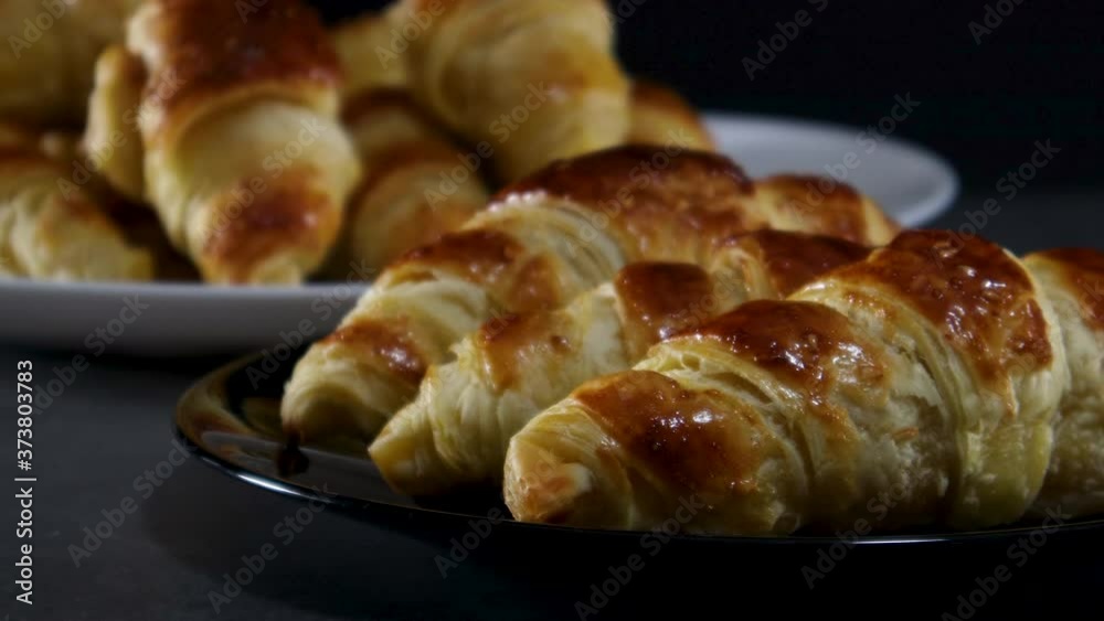 Close up of delicious croissants on plate on the table Close up of delicious croissants on plate on the table