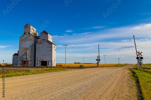 An old abandoned grain elevator in the town of Leney in the prairie province of Saskatchewan, Canada. These elevators were once used to store wheat and other grains before it was loaded onto trains
