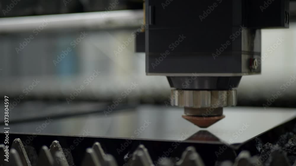 Laser machine cutting sheet of steel on industrial manufacture Laser machine cutting sheet of steel on industrial manufacture