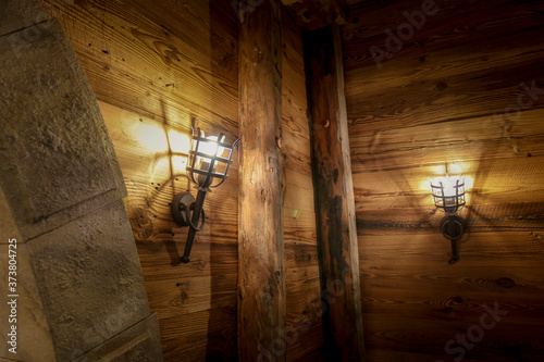 The lamp on the brown wooden in a mine .