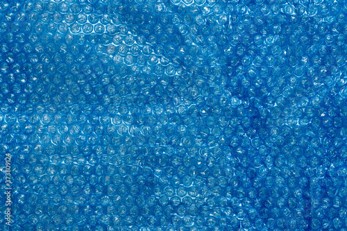 Bubble wrap, blue packaging material texture, and background.