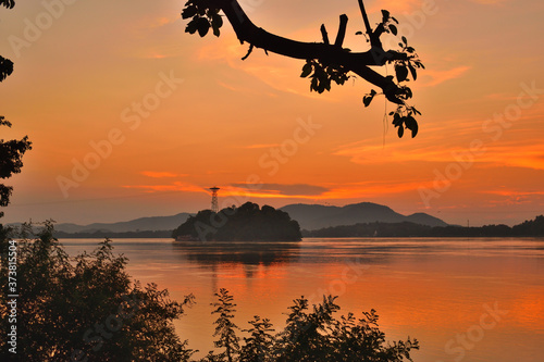 Umananda Island or Peacock Island on Brahmaputra river during sunset. 