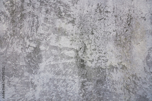 Texture of a smooth gray concrete wall as background or wallpaper. Close up of concrete wall with rough texture. Cement texture. © YanaKho