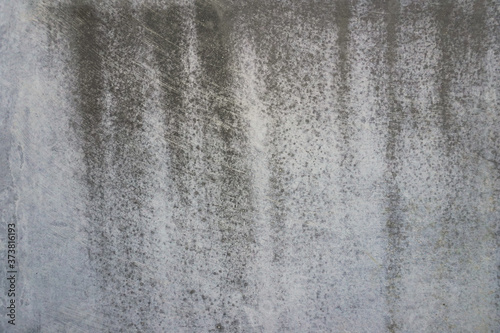 Texture of a smooth gray concrete wall as background or wallpaper. Close up of concrete wall with rough texture. Cement texture.