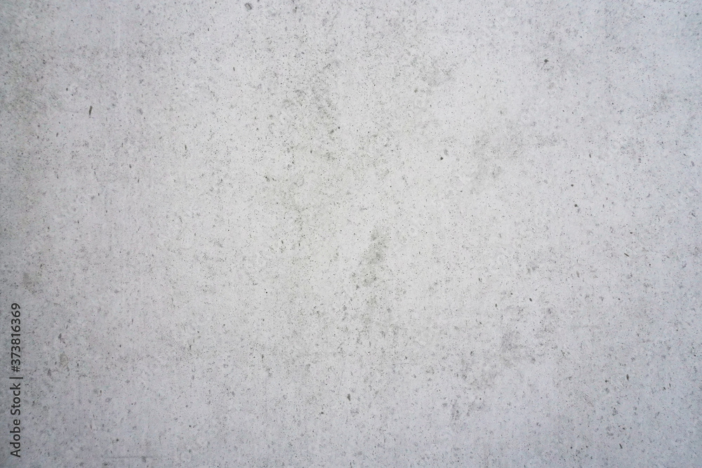 Fototapeta premium Texture of a smooth gray concrete wall as background or wallpaper. Close up of concrete wall with rough texture. Cement texture.