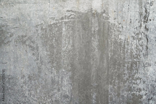 Texture of a smooth gray concrete wall as background or wallpaper. Close up of concrete wall with rough texture. Cement texture. © YanaKho