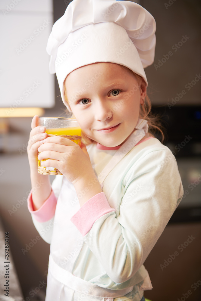 little girl in apron and hat little girl in apron and hat